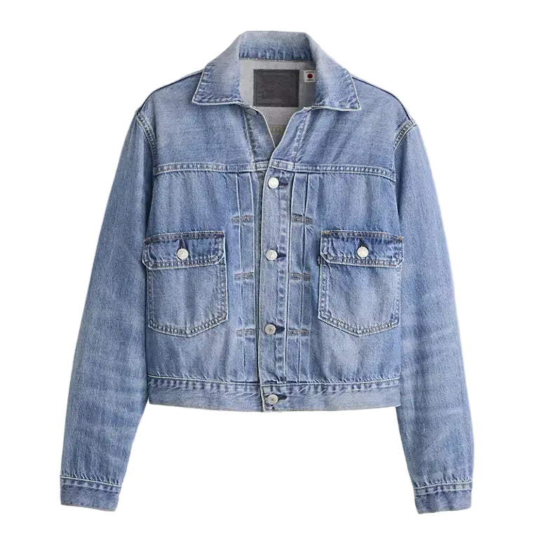 Blue denim jacket on a light gray background