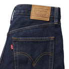 Close-up of Levi's jeans with brand label and logo on a white background