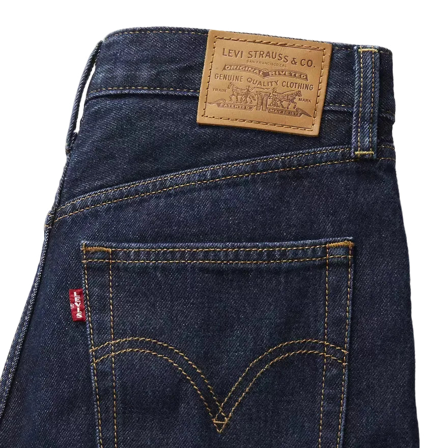 Close-up of Levi's jeans with brand label and logo on a white background