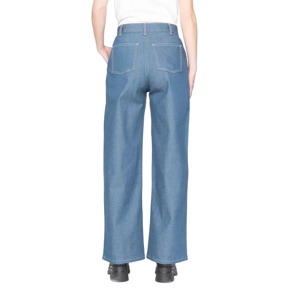 Back view of a person wearing blue denim pants on a white background