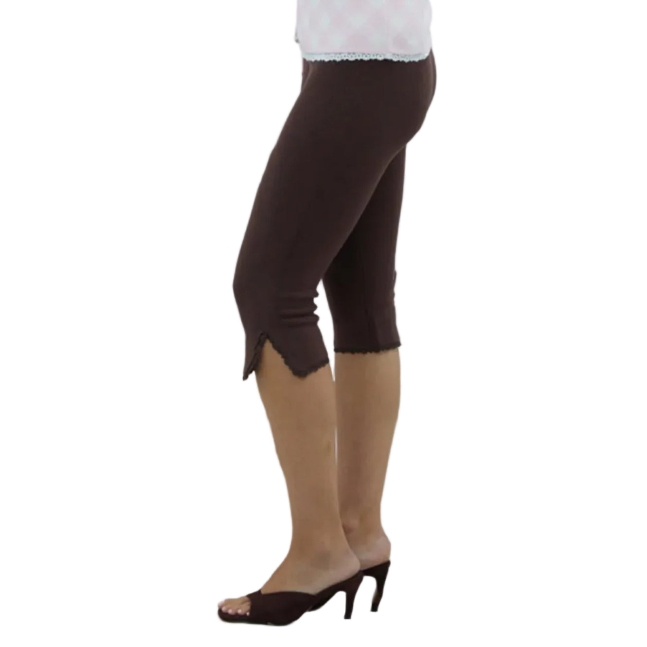 Person in Brown capri leggings on a white background