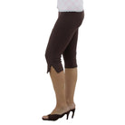 Person in Brown capri leggings on a white background