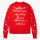 Red sweater with white text and star patterns on a white background