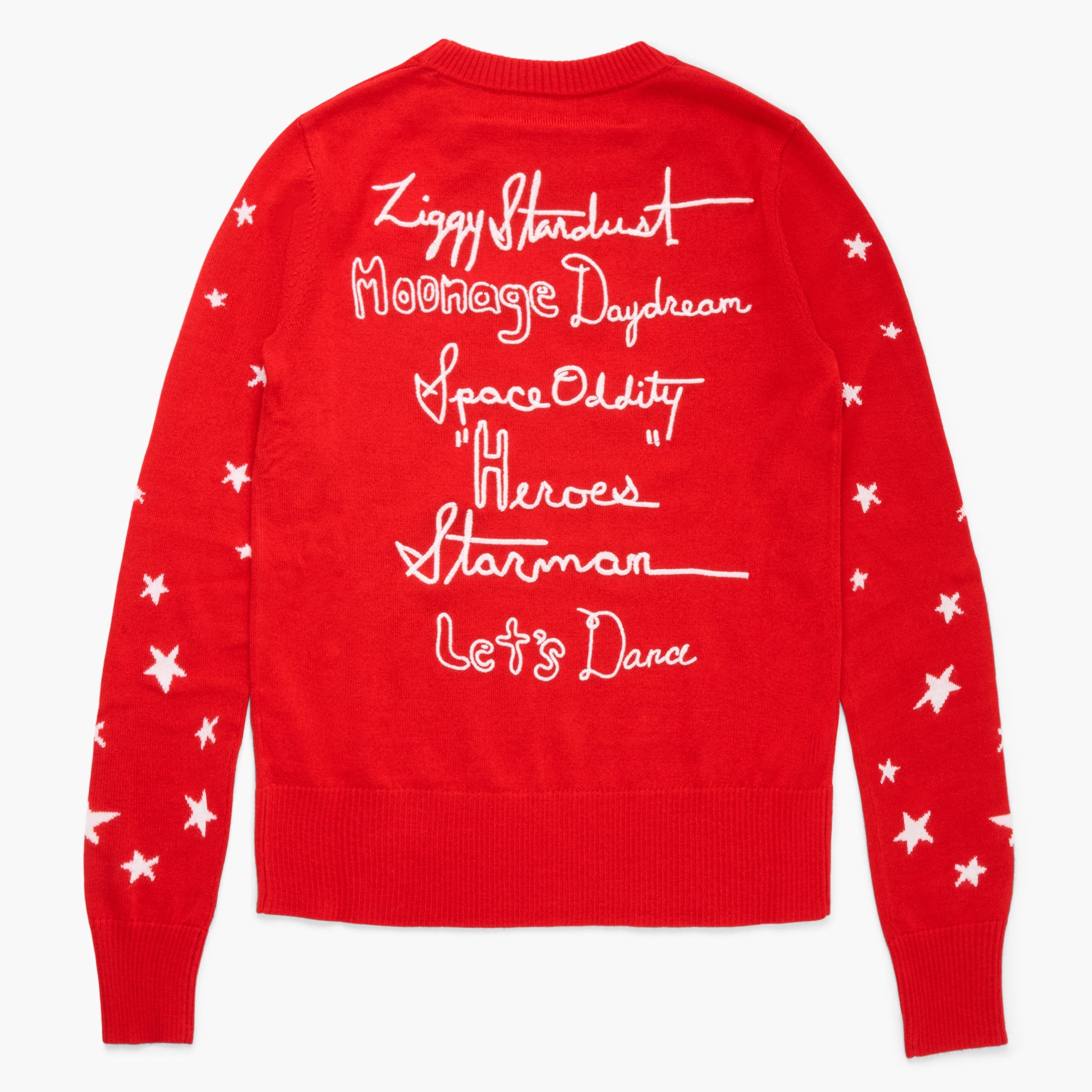 Red sweater with white text and star patterns on a white background