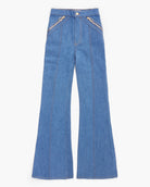 Blue denim flared pants on a white background