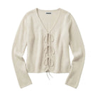 A cream-colored knit cardigan sweater with long sleeves, a V-neckline, and a front tie closure, laid flat against a white background.