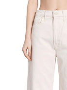 White pants worn by a person on a white background