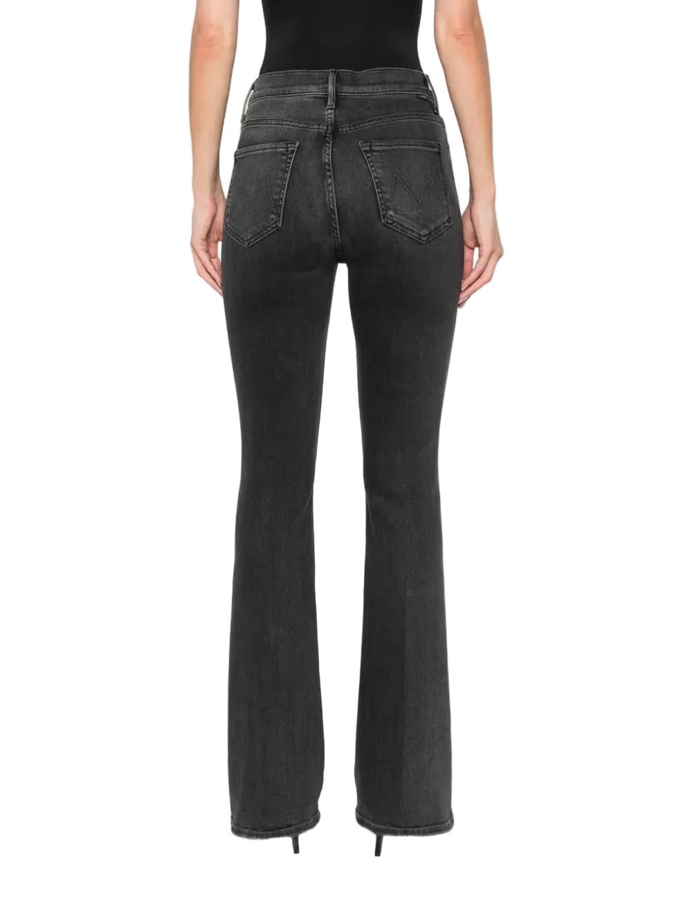 Black flared jeans worn by a person on a white background