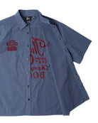 Blue workshirt with embroidered logos on a white background