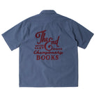Back of a blue workshirt with embroidered logos on a white background