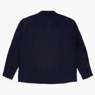 Back view of a navy button down shirt on a white background