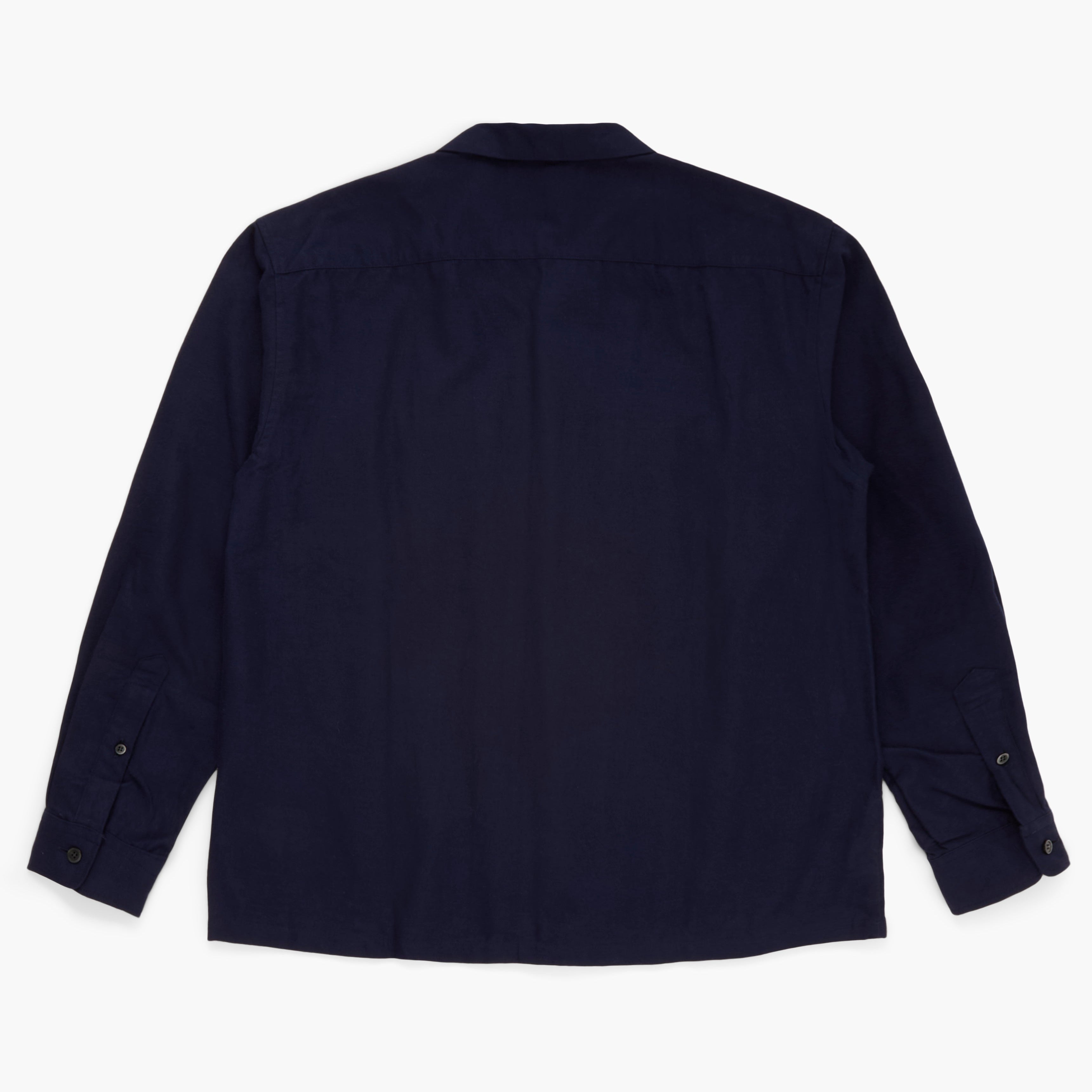 Back view of a navy button down shirt on a white background