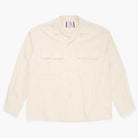 Cream button down shirt on a white background
