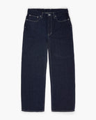 Wide-leg dark blue jeans on a white background