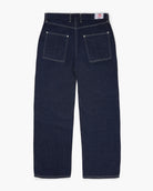 Wide-leg dark blue jeans on a white background