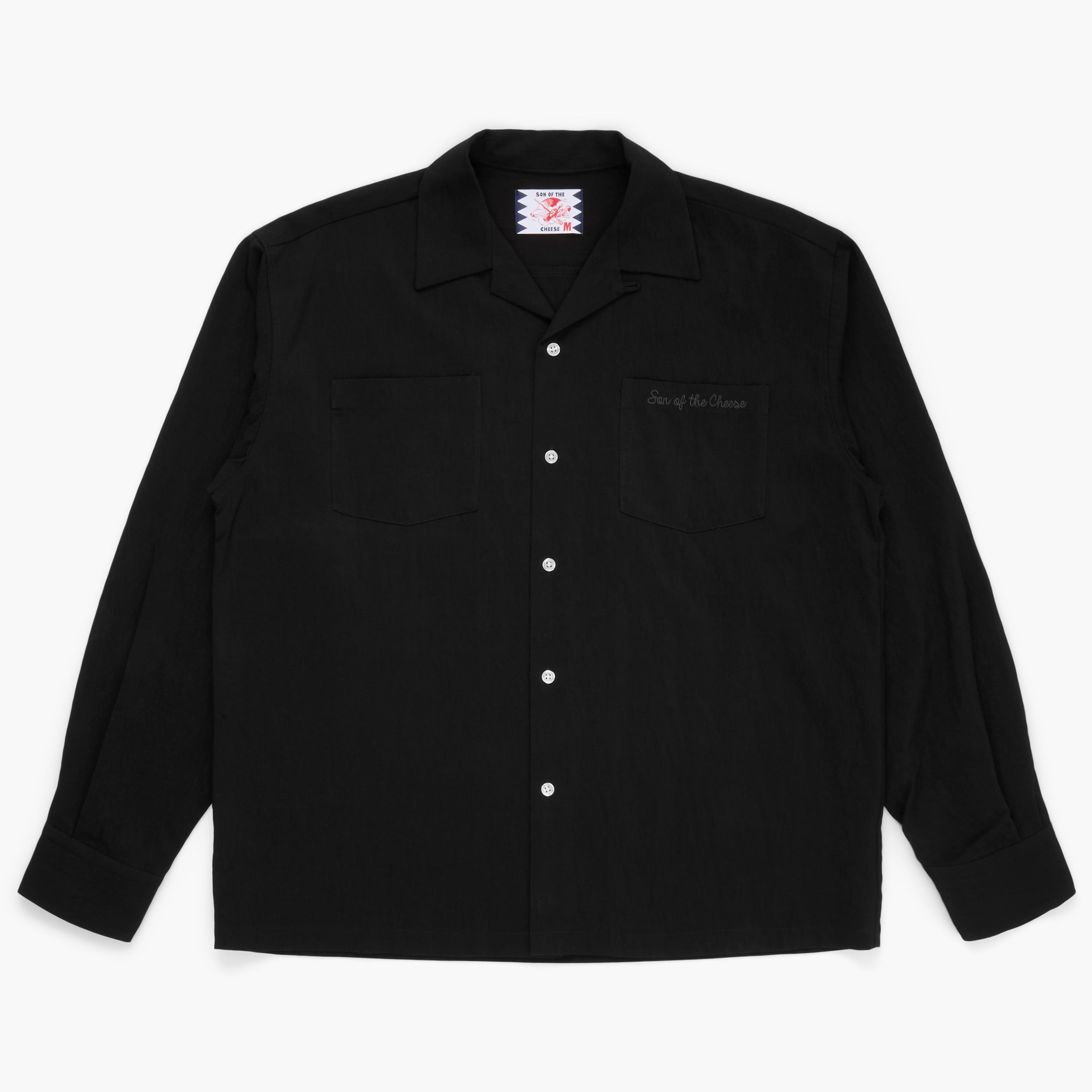 Black button down shirt on a white background 