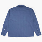 Back view of a blue button down shirt on a white background
