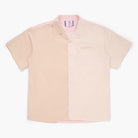 Beige, tan, and pink button down short sleeve shirt on a white background 