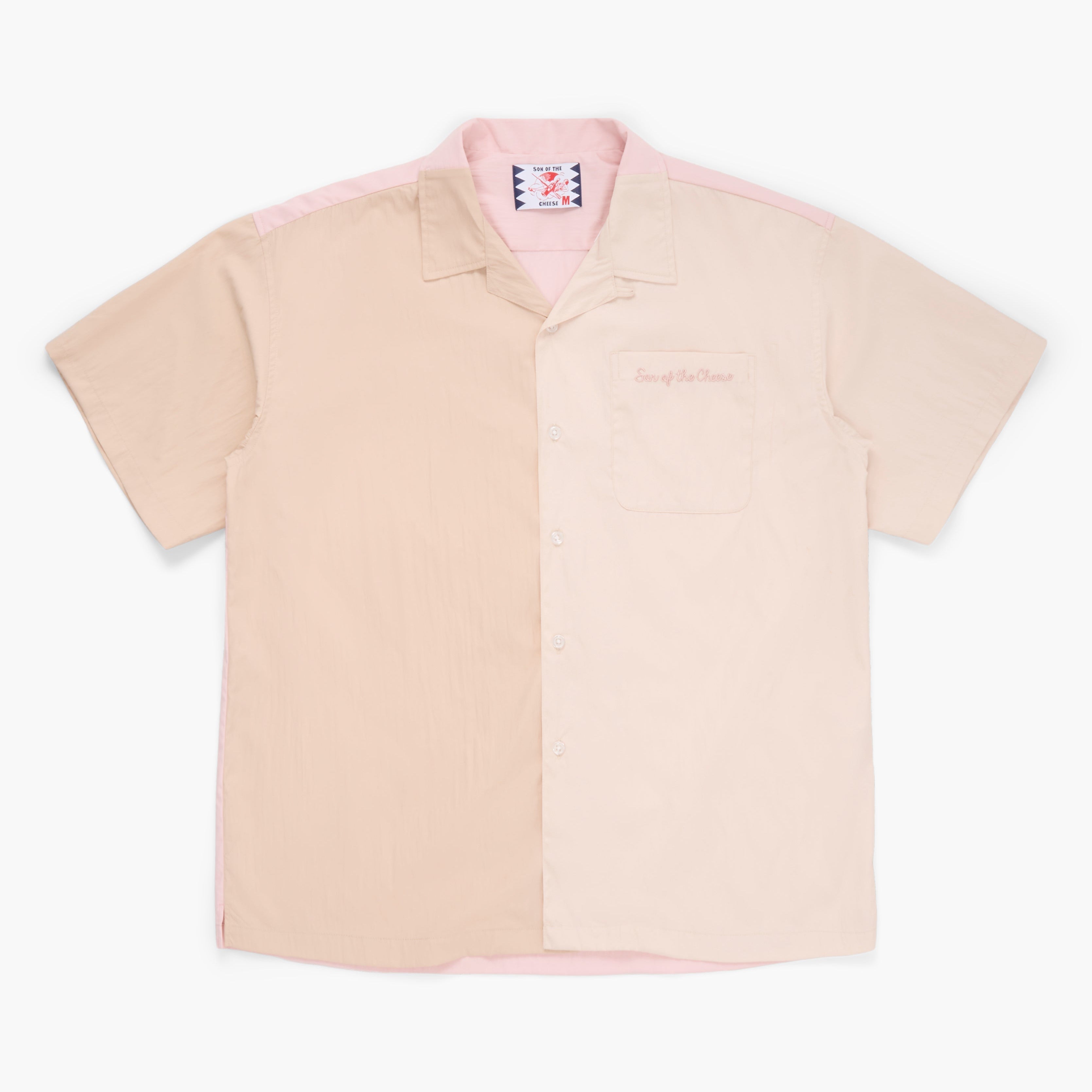 Beige, tan, and pink button down short sleeve shirt on a white background 