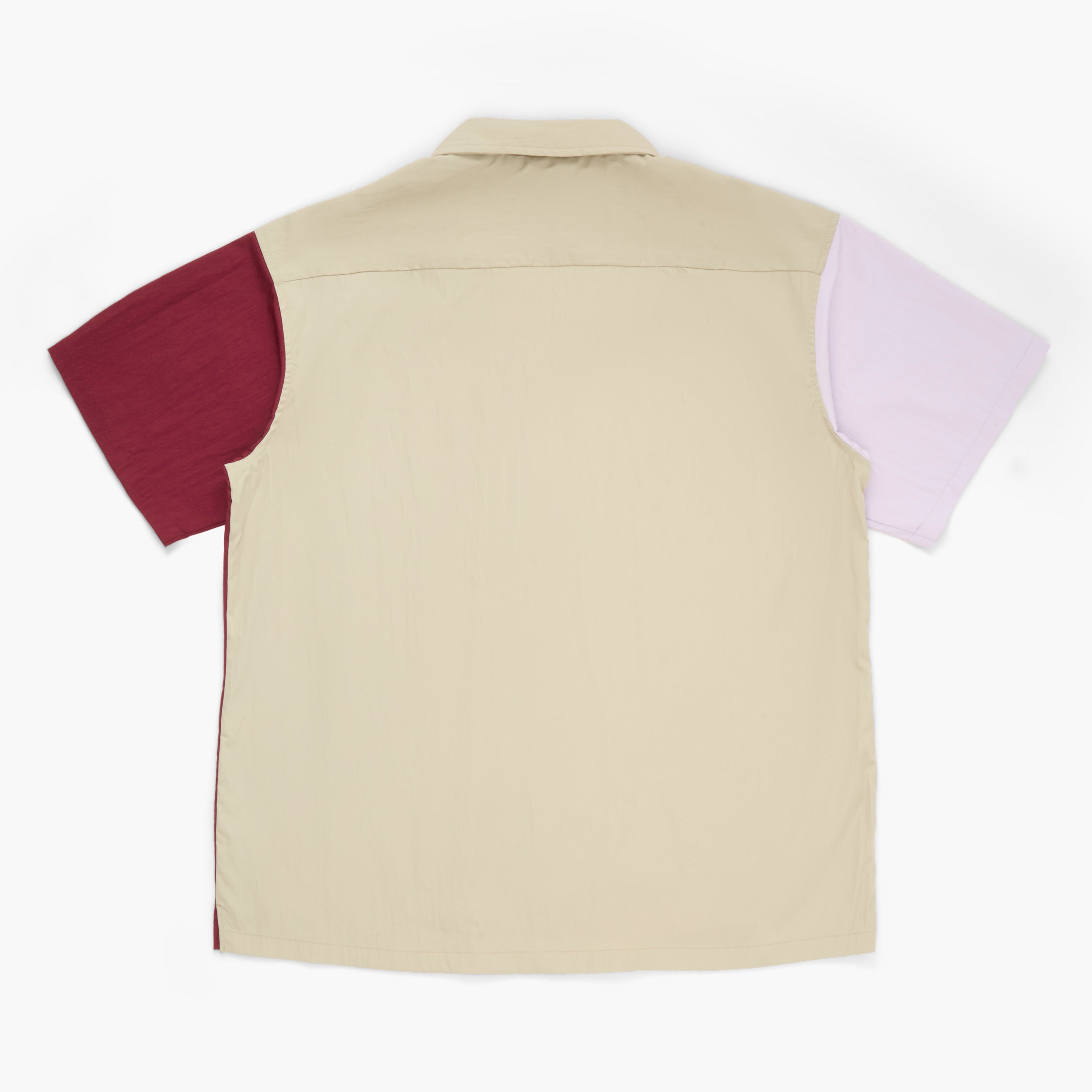 Back view of a maroon, violet, and tan short-sleeved button-down shirt on a white background