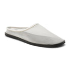 3/4 view of a white mesh mule with a flat black sole on a white background 