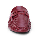 Front view of a glossy red leather penny loafer mule on a plain white background.
