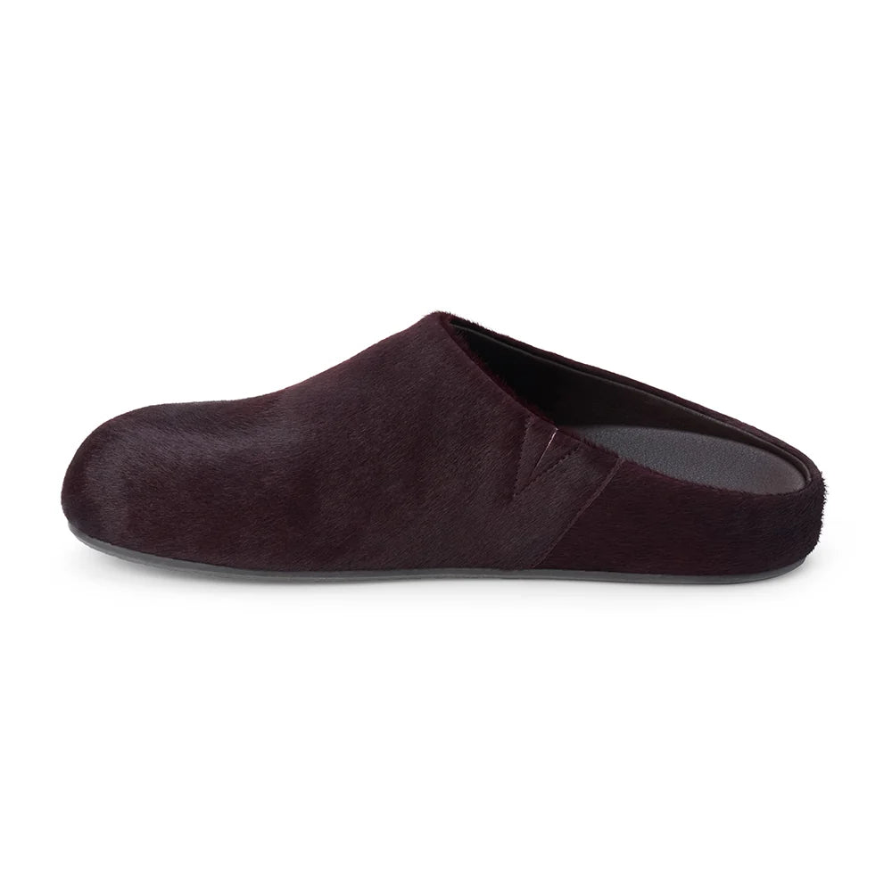 A single dark plum-brown mule slipper with a soft textured upper and a dark gray sole on a white background.