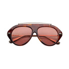 Tortoise sunglasses with red lenses and gold detailing on a white background
