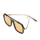 Square aviator-style sunglasses with amber-tinted lenses, a dark tortoiseshell frame, and slim gold metal temples, shown on a clean white background.