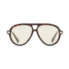 Tortoise framed sunglasses with yellow lenses and gold accents on a white background