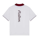 White polo with a maroon collar and logo down the back on a white background