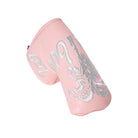 Pink blade putter cover with white embroidered details on a white background