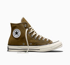 Green high top sneakers on a white background
