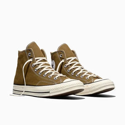 Green high top sneakers on a white background