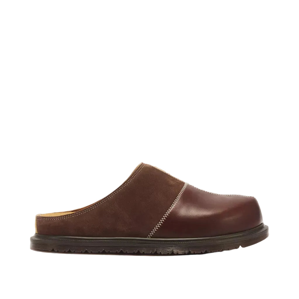 A single dark brown leather and suede clog-style shoe shown in profile against a white background.