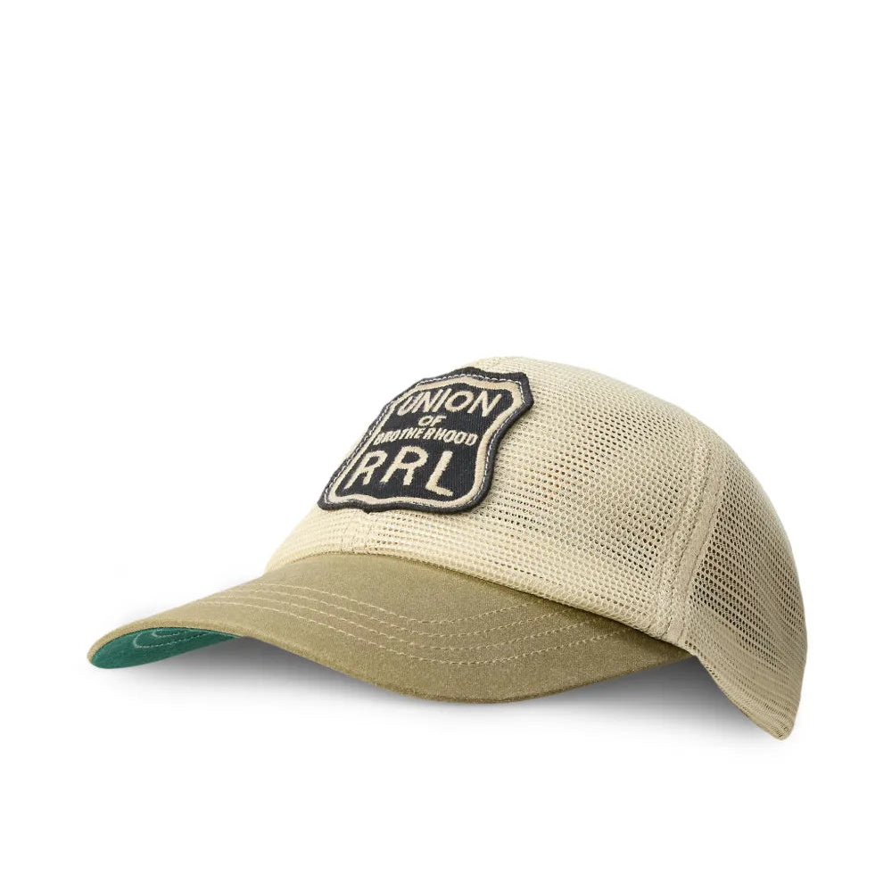 A beige trucker cap with a mesh back, featuring a black embroidered patch on the front with the text 'PIONEER by Harley-Davidson RRL' and a green visor underside, shown on a plain white background.