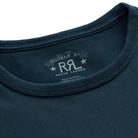 Close-up of a dark teal-blue crewneck t-shirt showing the inner neck label with the Double RL. Ralph Lauren logo.