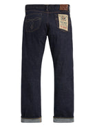 Dark blue denim jeans with a brand label on a white background