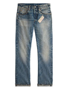 Pair of blue jeans with a tag on a white background