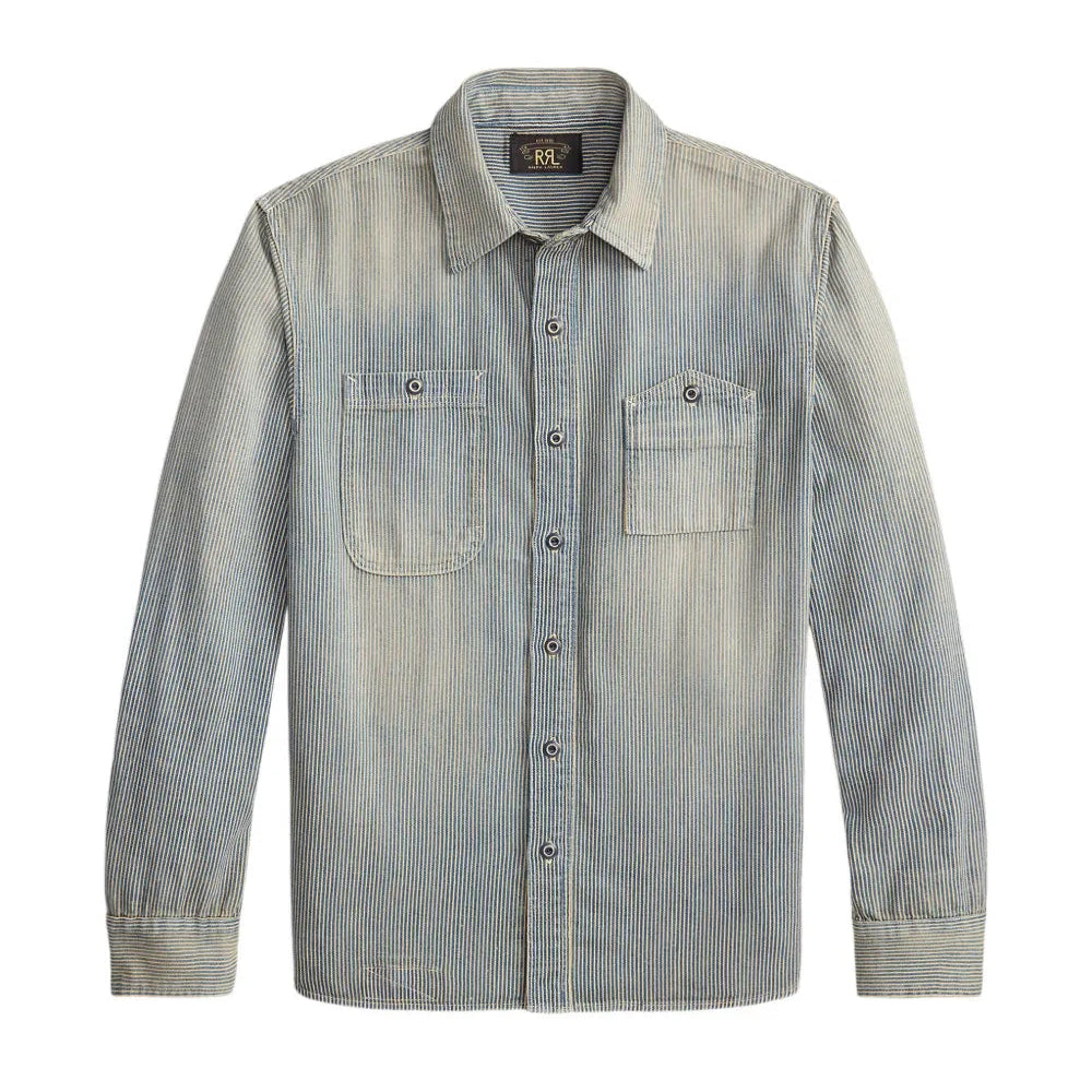 A light blue-gray denim button-up shirt with two chest pockets, displayed flat against a white background.