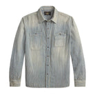 A light blue-gray denim button-up shirt with two chest pockets, displayed flat against a white background.