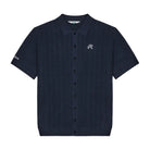A dark navy blue short-sleeve button-up shirt with a textured weave, featuring a small white embroidered script logo on the left chest and a matching logo on the right sleeve, displayed against a solid white background.