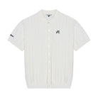An off-white short-sleeve knit button-up shirt with a small black embroidered logo on the left chest and a sleeve patch, displayed on a clean white background.