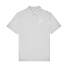 A light gray short-sleeve polo shirt with a small white embroidered logo on the left chest, displayed against a solid white background.