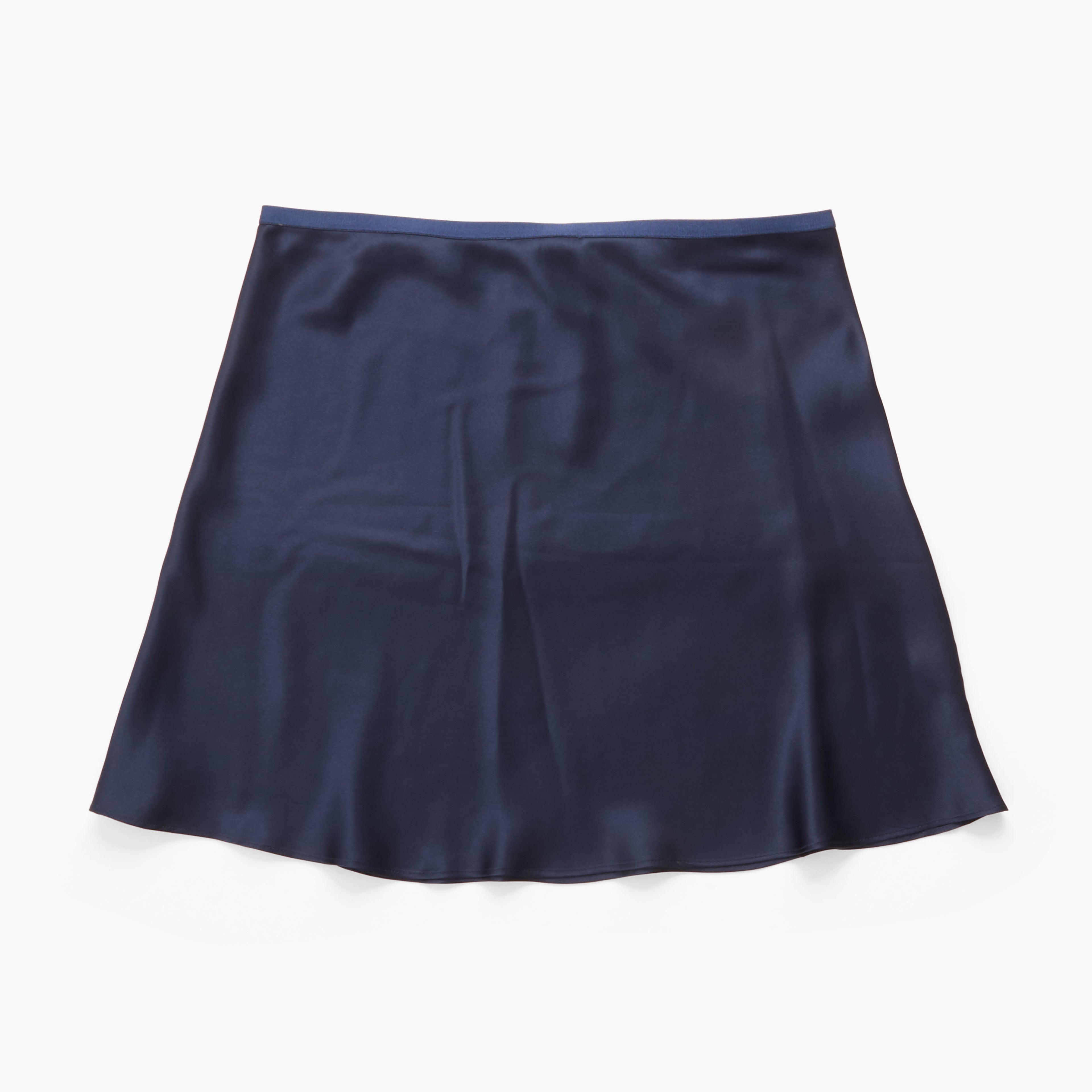 A navy blue silky skirt with a subtle sheen, laid flat against a clean white background.