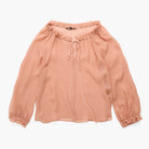 A peach-colored long-sleeve blouse with a ruffled off-the-shoulder neckline, a front tie detail, and gathered elastic cuffs, shown flat on a white background.