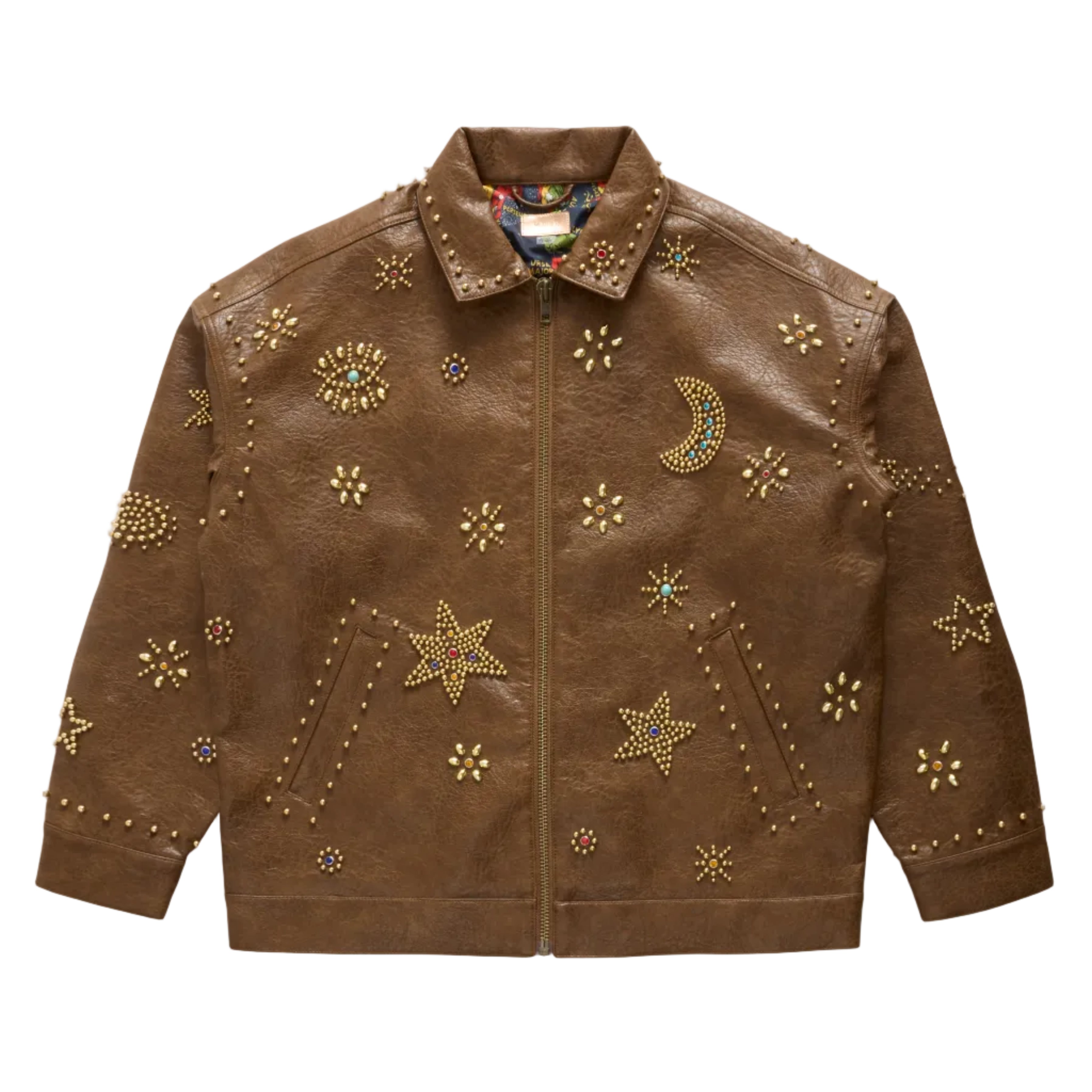 A brown faux-leather jacket decorated with gold-toned studs, stars, moons, and floral embellishments, displayed flat against a white background.