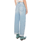 Person wearing a white t-shirt and light blue jeans on a white background