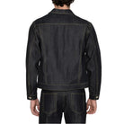 A man viewed from the back wearing a dark indigo denim jacket and matching dark jeans against a plain white background.