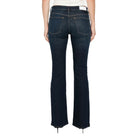 Back view of the Micro Boot Jean on a model, showing the back pockets, a waistband label patch and the bootcut hem.